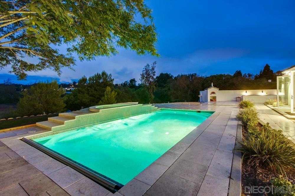 4124 Stonebridge Lane Rancho Santa Fe, CA 92091 - Photo 30 of 38 a view of a backyard with swimming pool