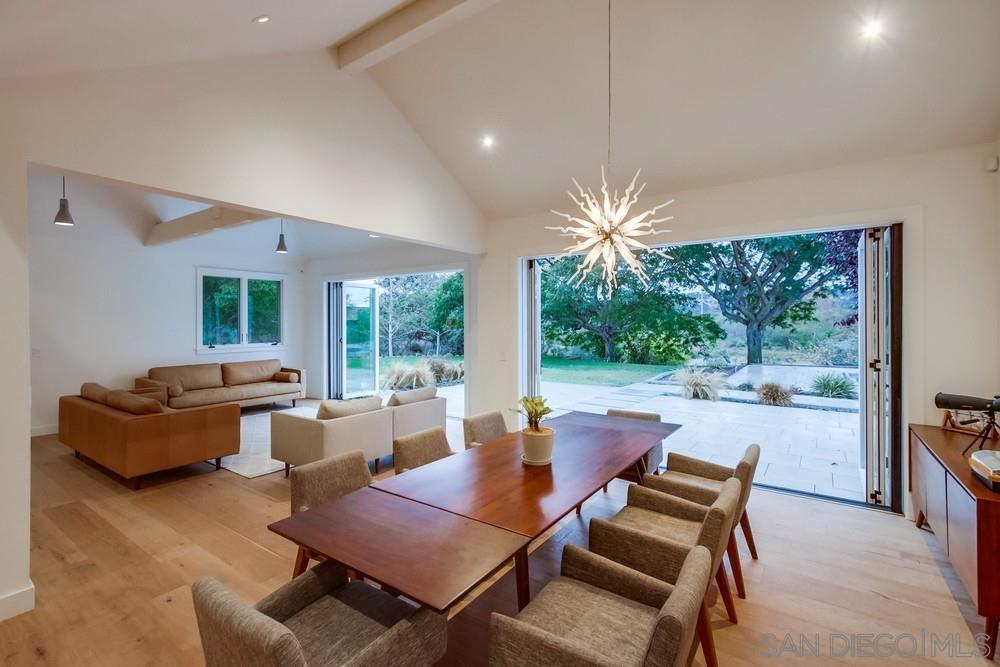 4124 Stonebridge Lane Rancho Santa Fe, CA 92091 - Photo 7 of 38 a dining room with furniture and a large window