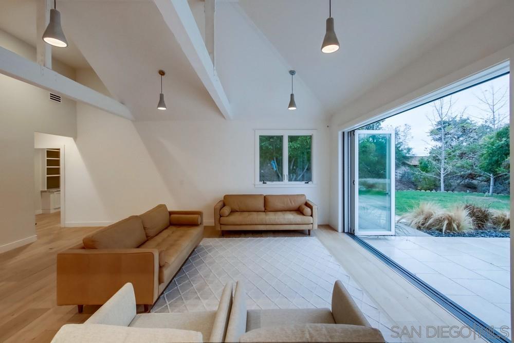 4124 Stonebridge Lane Rancho Santa Fe, CA 92091 - Photo 8 of 38 a living room with furniture and a large window