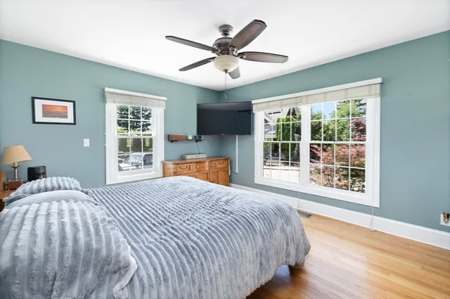 a bedroom with a large bed and a window