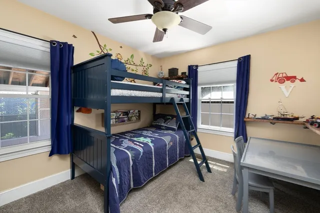 a bed room with a bed and a window