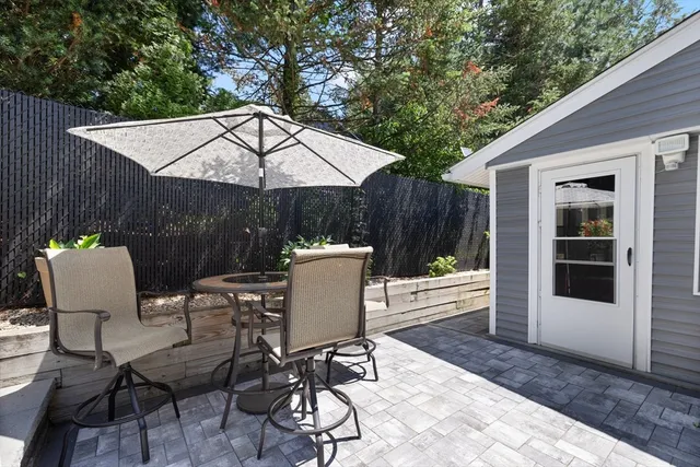 a view of a chairs and table in the patio