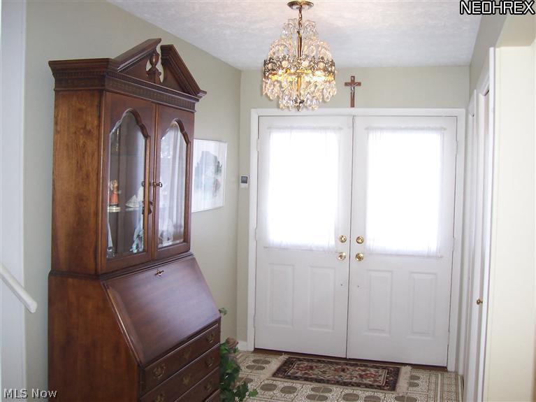 Foyer with ceramic tile imported from Italy.