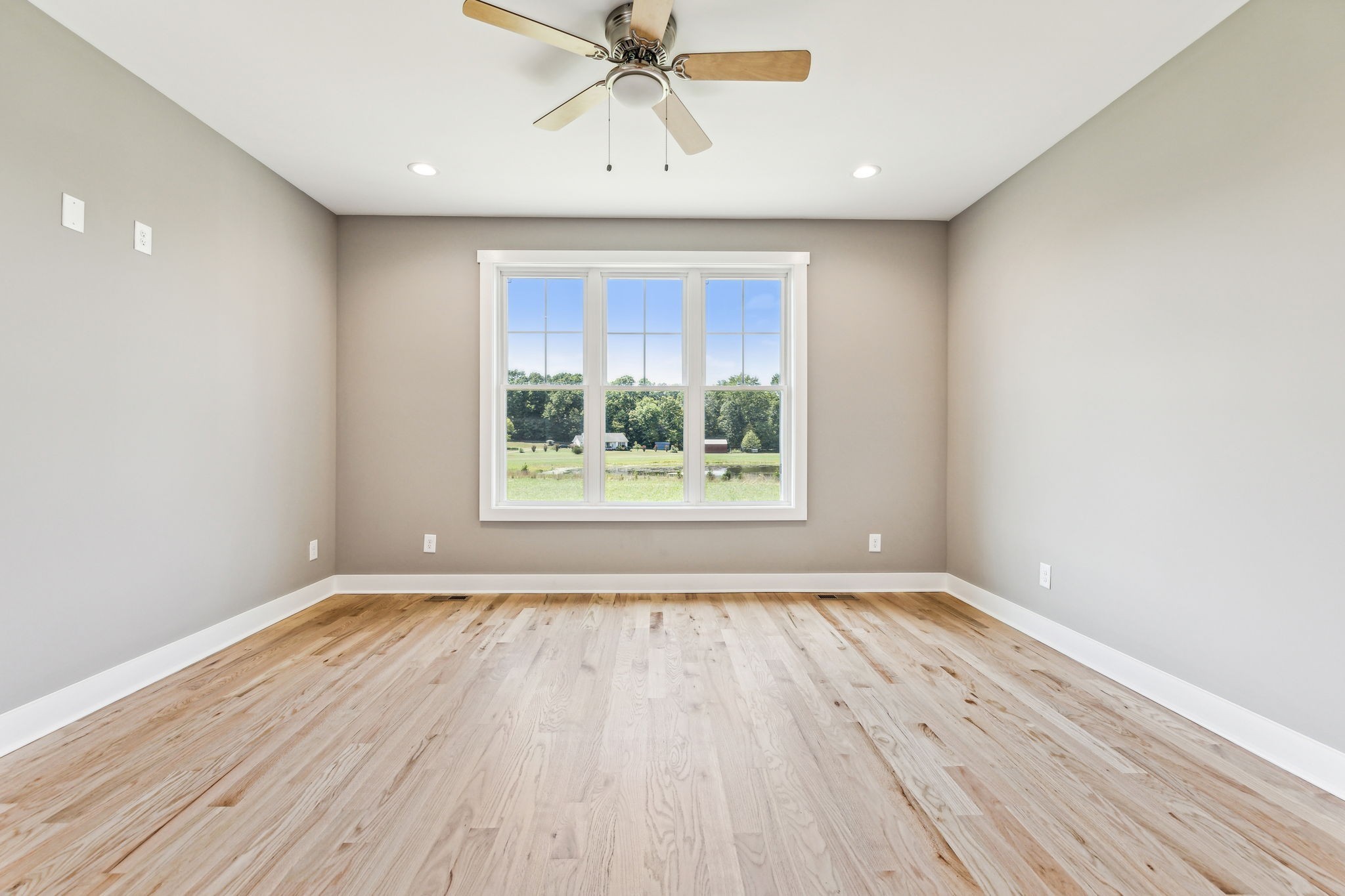 43 Long Branch Road Lawrenceburg, TN 38464 - Photo 23 of 52 wooden floor in an empty room with a window