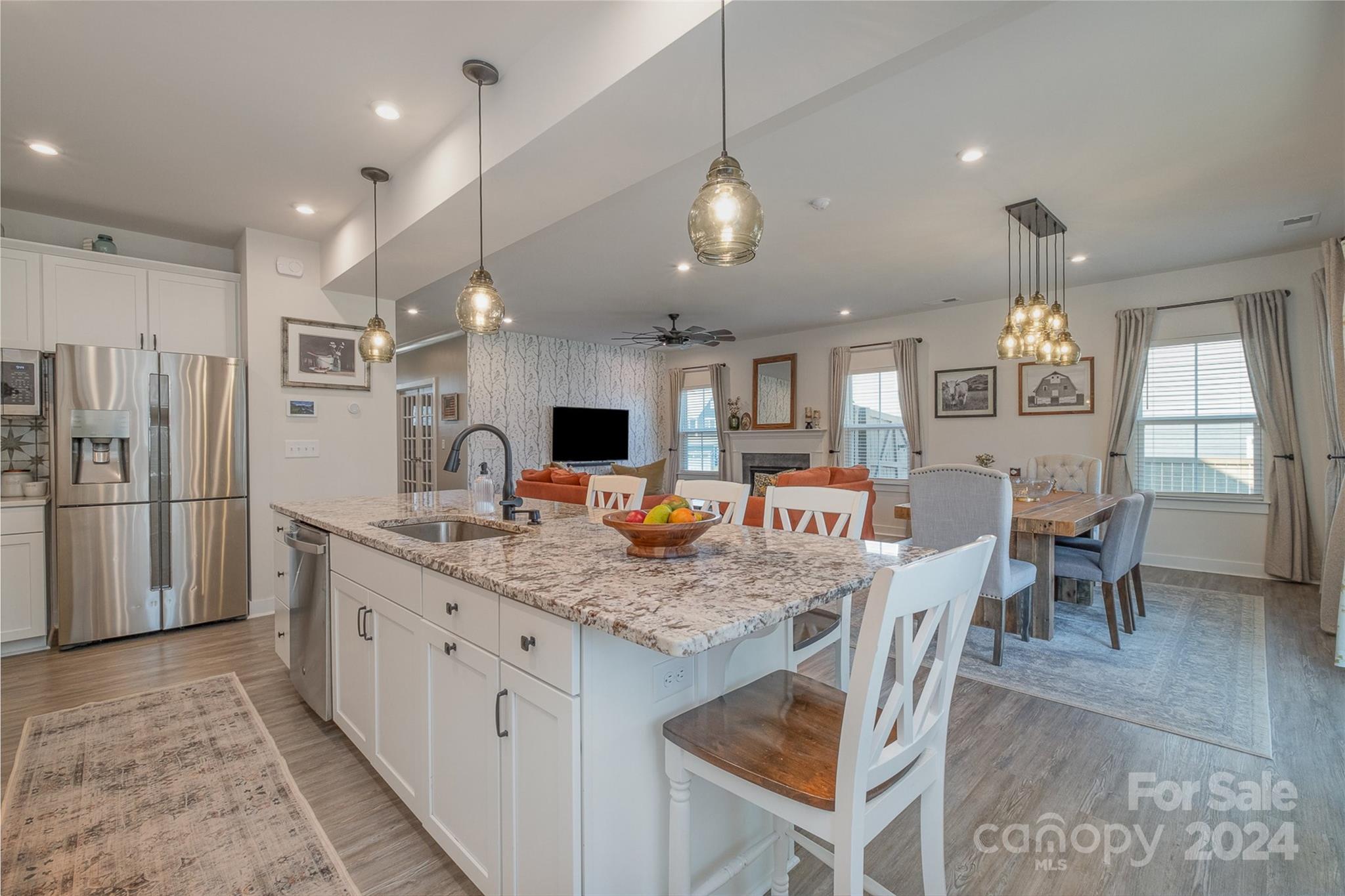 6202 Holland Street Fort Mill, SC 29707 - Photo 12 of 39 a kitchen with stainless steel appliances granite countertop a kitchen island a stove a table and chairs
