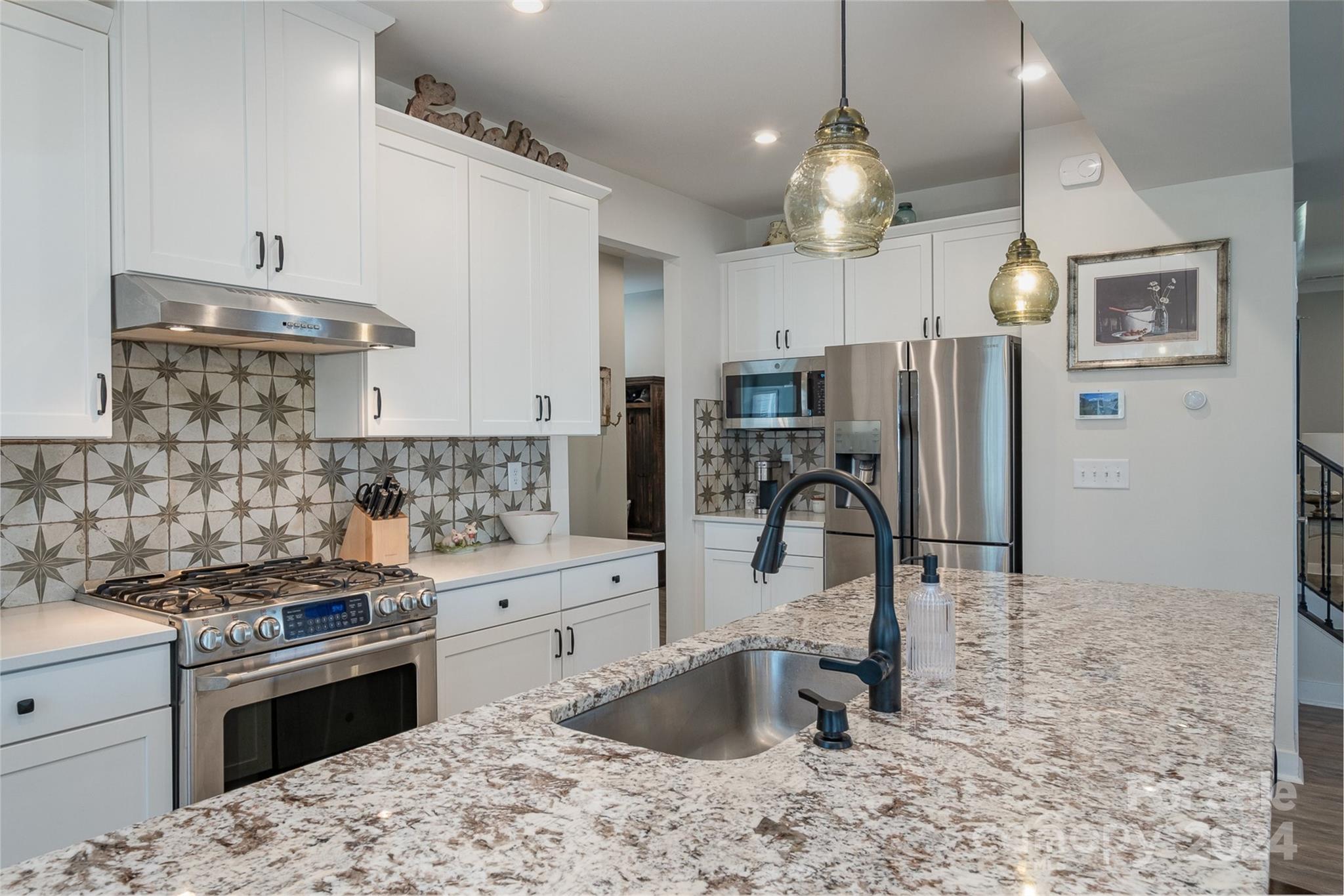 6202 Holland Street Fort Mill, SC 29707 - Photo 14 of 39 a kitchen with a sink stove and refrigerator