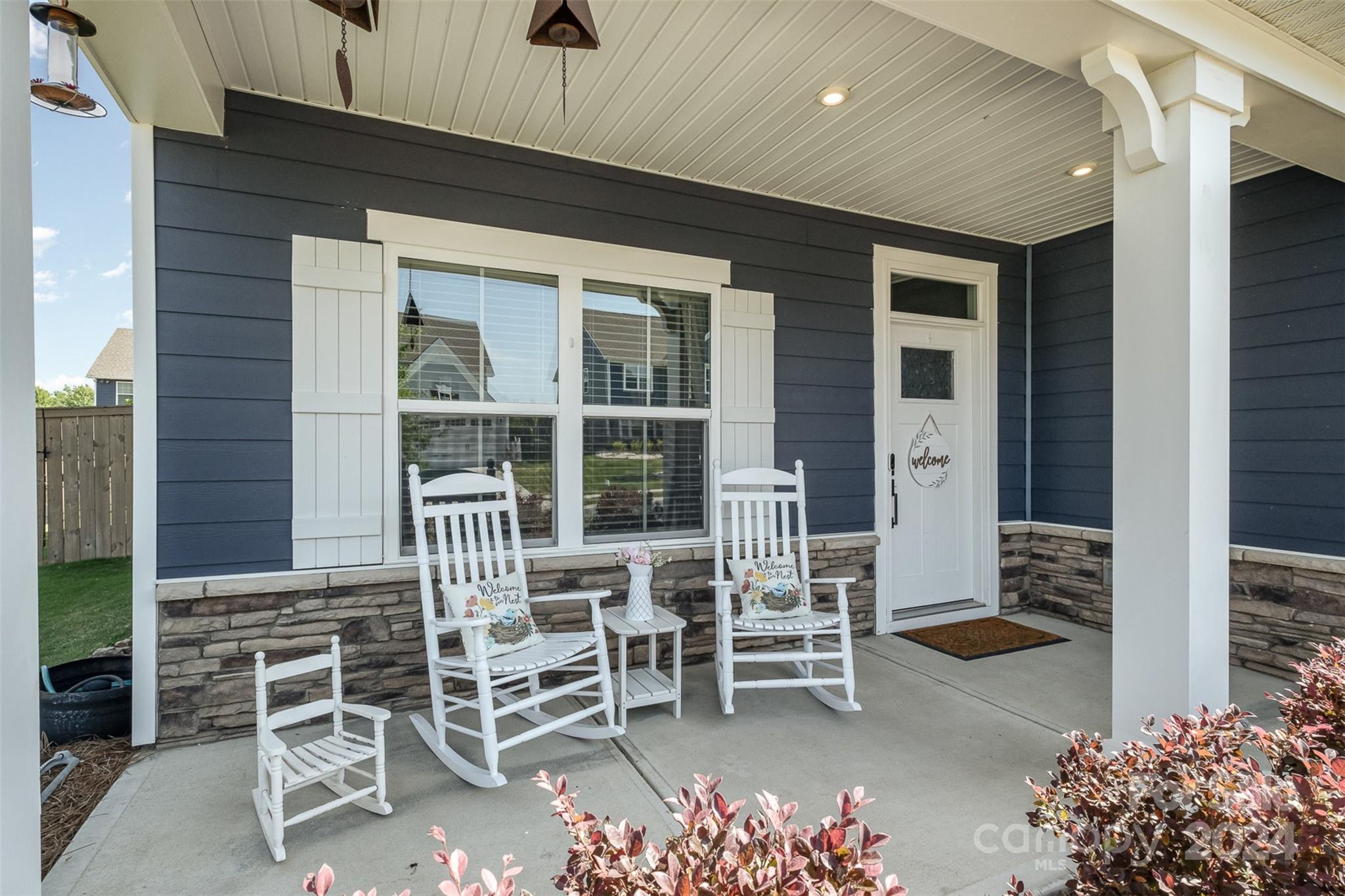 6202 Holland Street Fort Mill, SC 29707 - Photo 2 of 39 a patio with table and chairs and potted plants