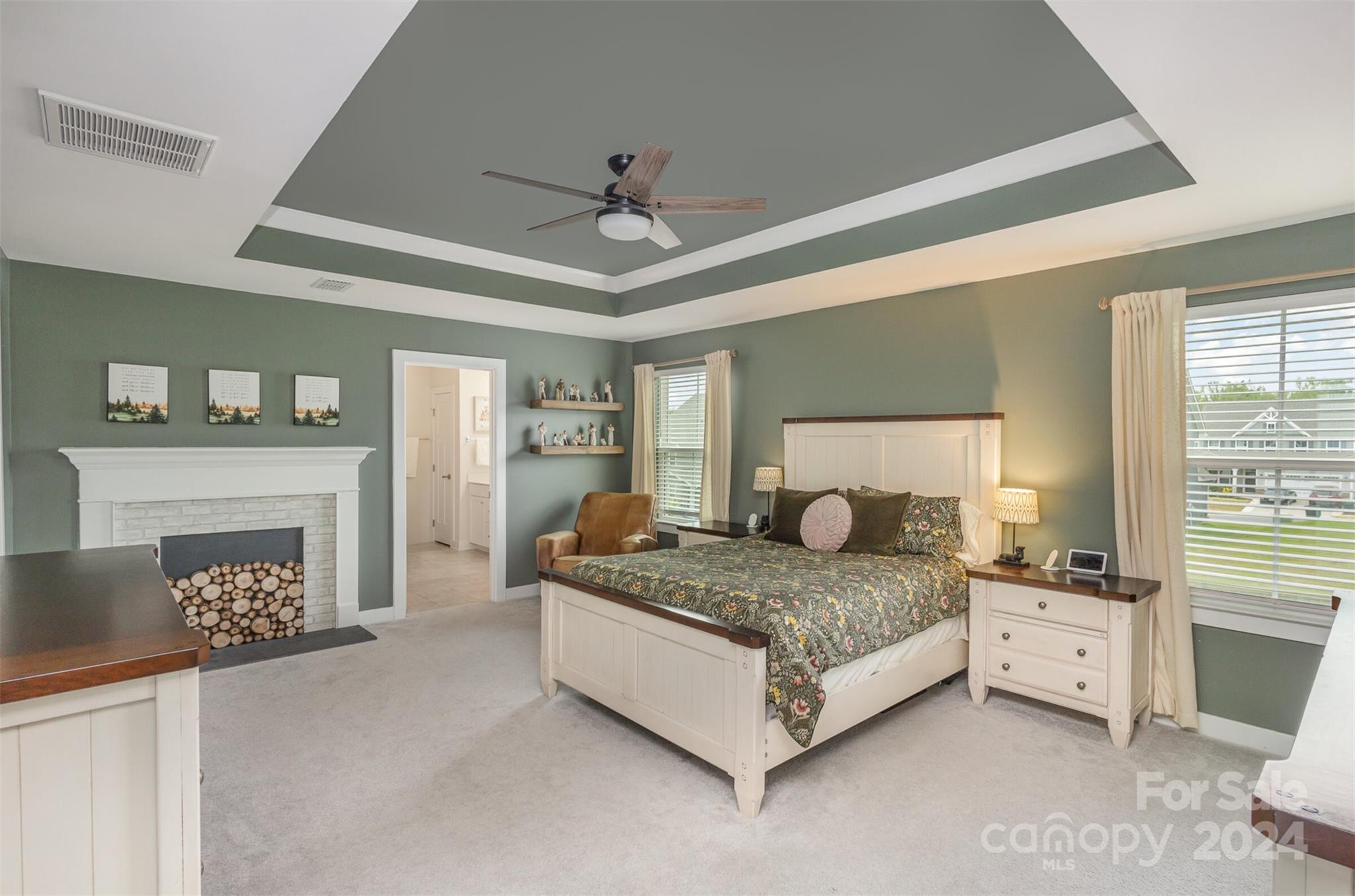 6202 Holland Street Fort Mill, SC 29707 - Photo 21 of 39 a bedroom with a bed and a fireplace