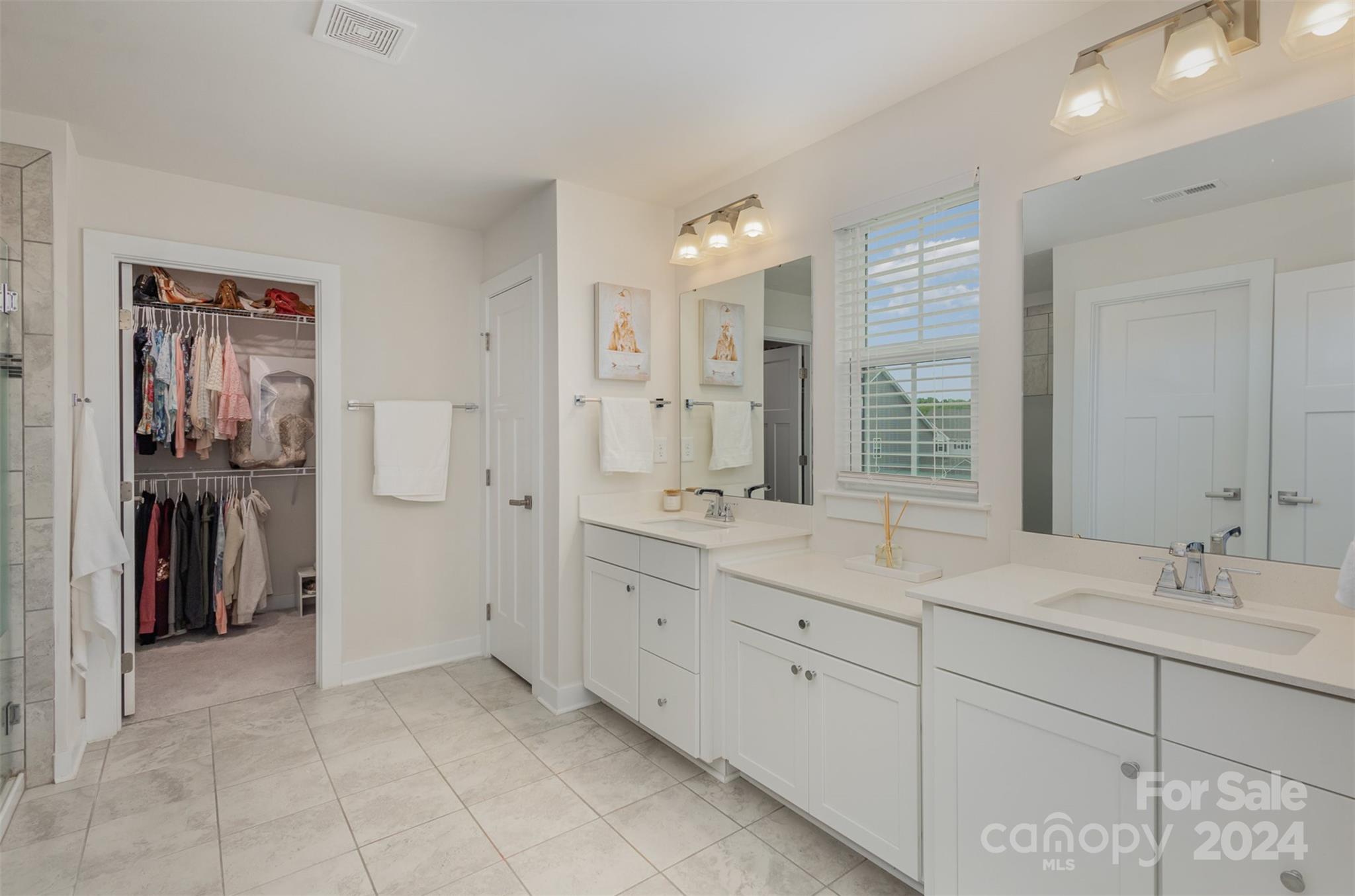 6202 Holland Street Fort Mill, SC 29707 - Photo 23 of 39 a bathroom with a double vanity sink and a mirror