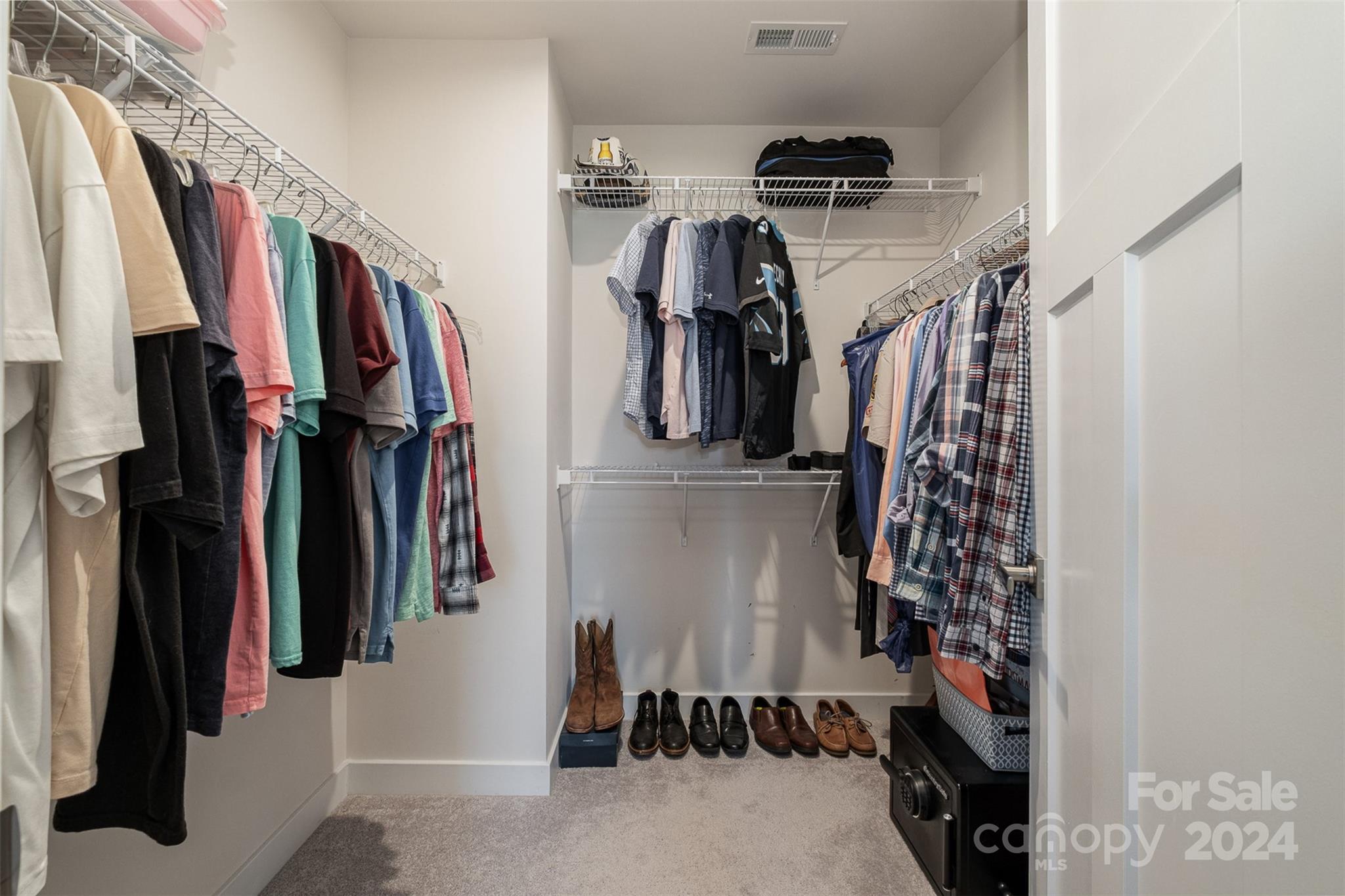 6202 Holland Street Fort Mill, SC 29707 - Photo 25 of 39 a view of walk in closet with clothes and shoes
