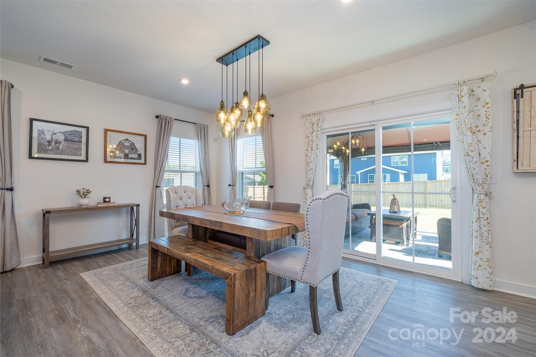 6202 Holland Street Fort Mill, SC 29707 - Photo 7 of 39 a view of a dining room with furniture and chandelier