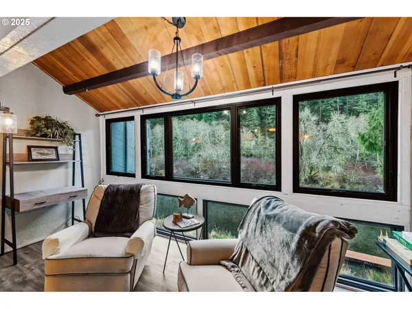 a balcony with furniture and a large window