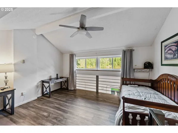 a bedroom with furniture and a window