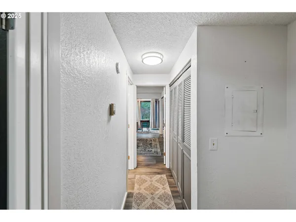 a view of a hallway view with staircase