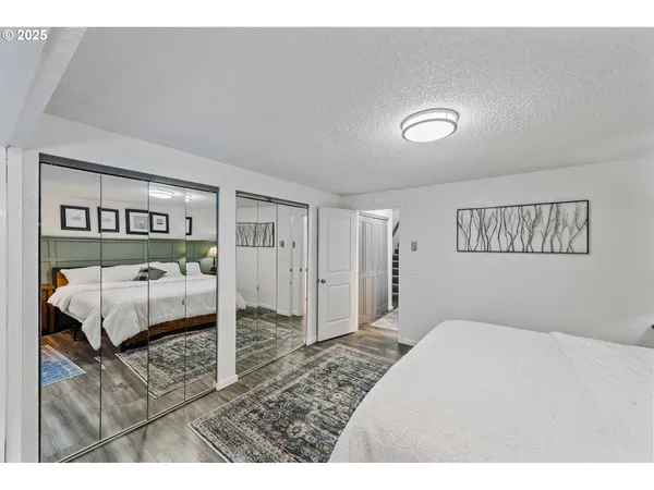 a bedroom with a bed and a view of bathroom