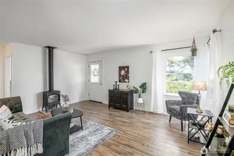 a living room with furniture and a table