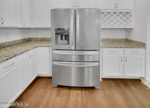 a stove top oven sitting inside of a kitchen