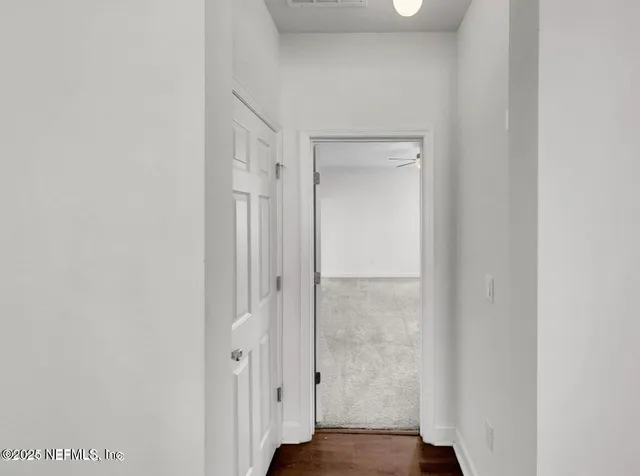 a bedroom with a large bed and a flat screen tv