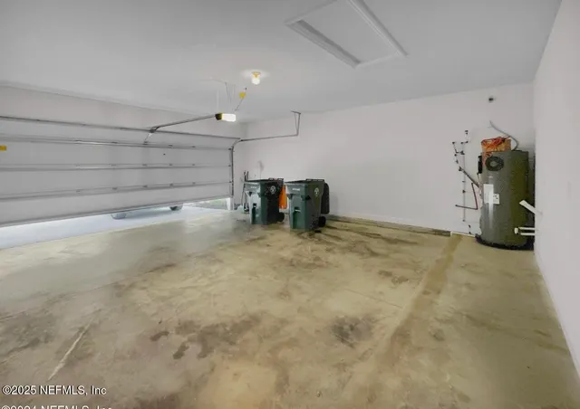 a dining room with furniture and a window