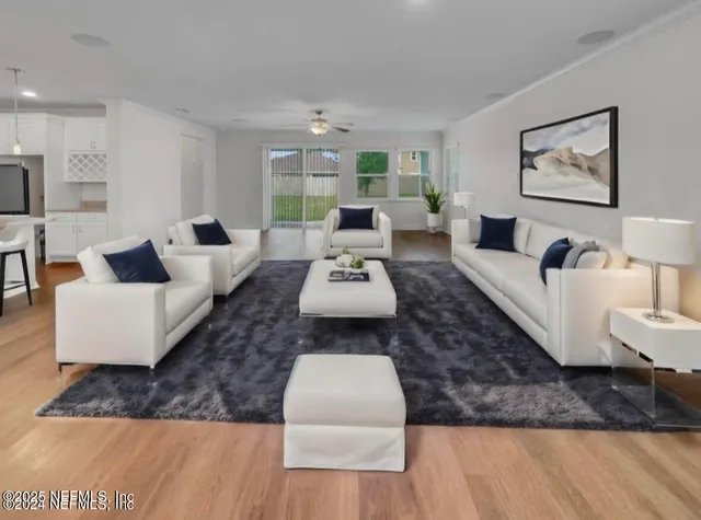 a view of wooden floor and windows in kitchen
