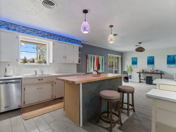 a kitchen with cabinets and sink