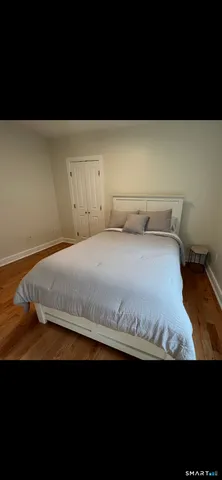 a bedroom with a bed and a cabinets