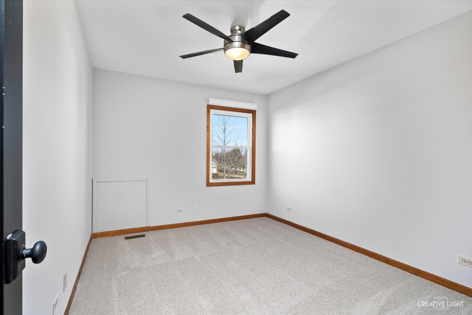 13332 Round Barn Road Plainfield, IL 60585 - Photo 17 of 30 an empty room with a window and a ceiling fan