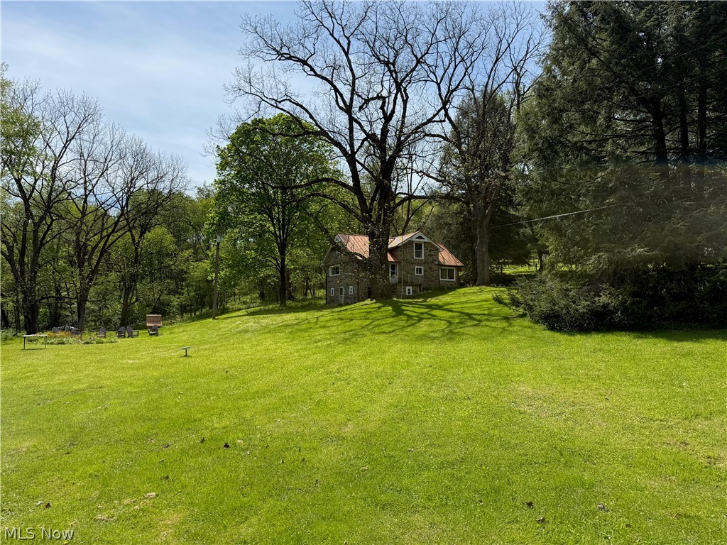 11811 Gaston Road Rogers, OH 44455 - Photo 18 of 38 You've got several acres of usable space, pole barns, and a Quonset Hut (currently used for recreation). Take advantage of the room to play, and play!!
