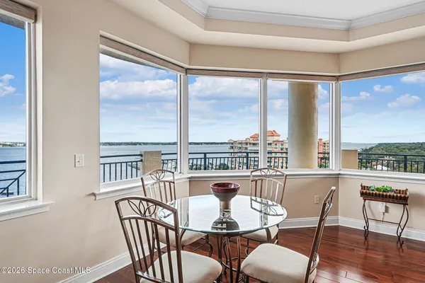 a view of a balcony with furniture