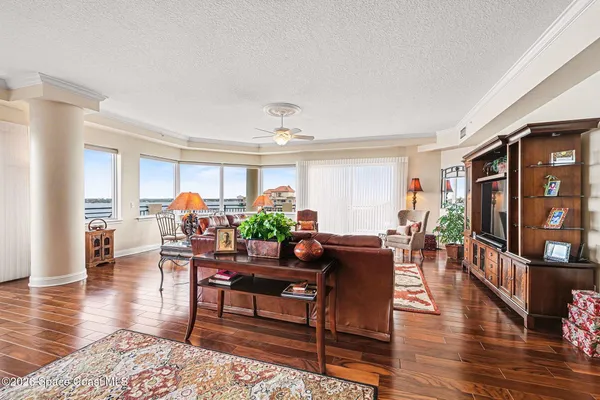 a kitchen with stainless steel appliances kitchen island granite countertop a table and chairs in it