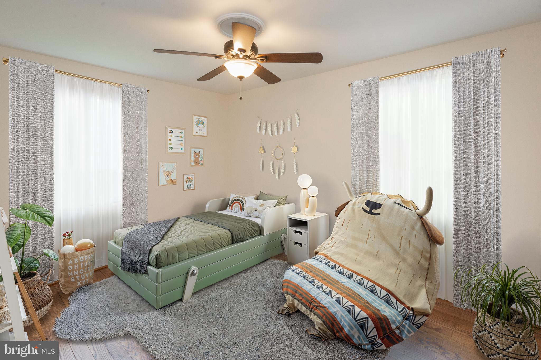 2016 Lansdowne Way Silver Spring, MD 20910 - Photo 11 of 23 a bedroom with bed and a chandelier