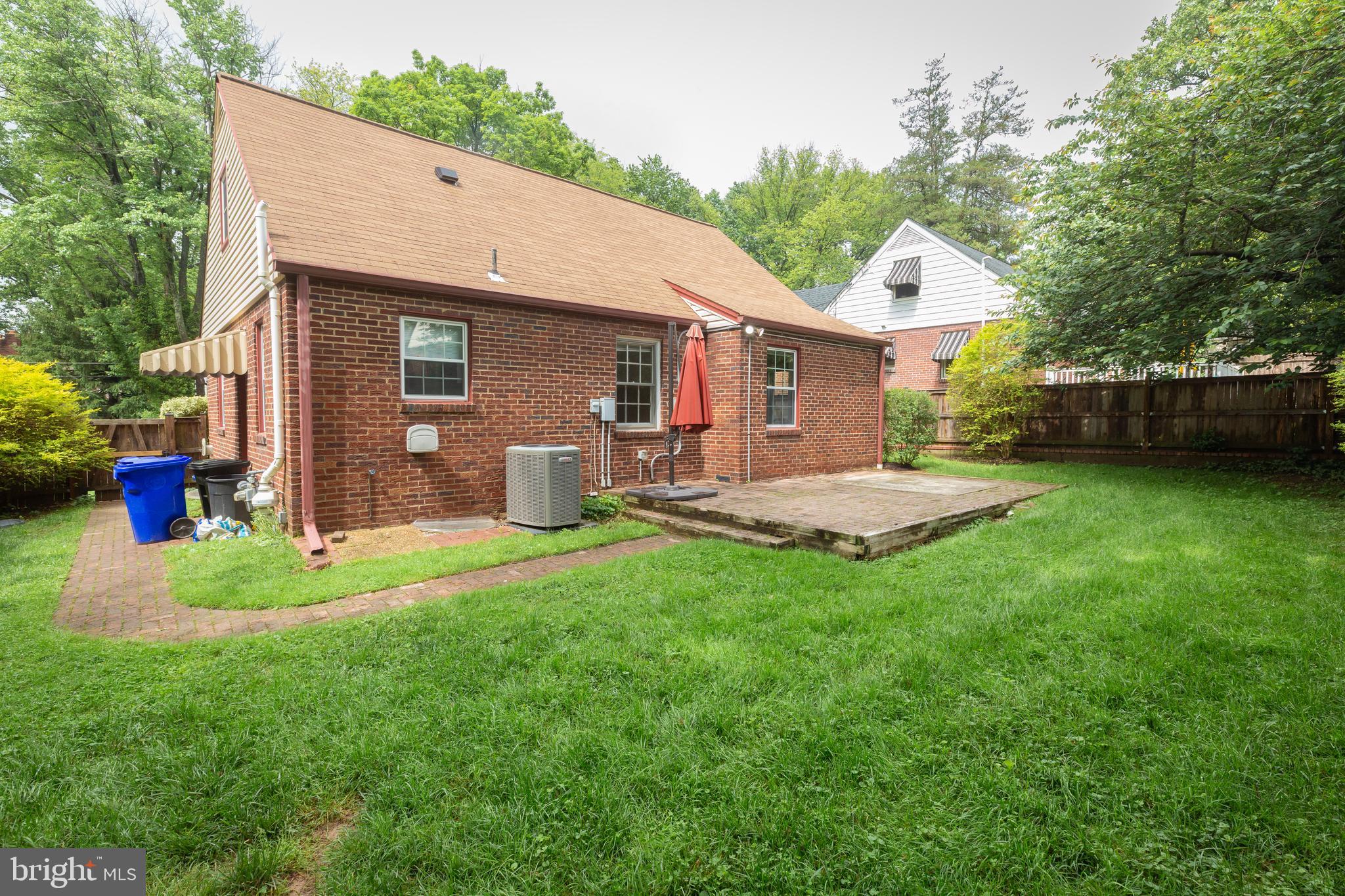 2016 Lansdowne Way Silver Spring, MD 20910 - Photo 23 of 23 a view of a backyard with table and chairs and potted plants