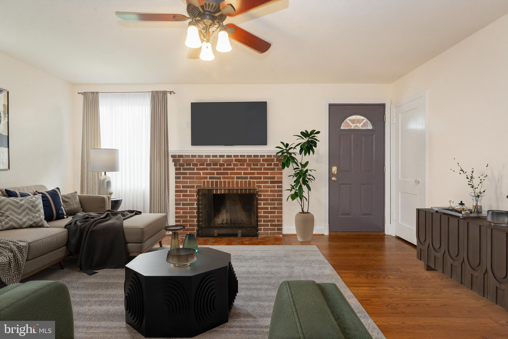 2016 Lansdowne Way Silver Spring, MD 20910 - Photo 3 of 23 a living room with furniture and a fireplace