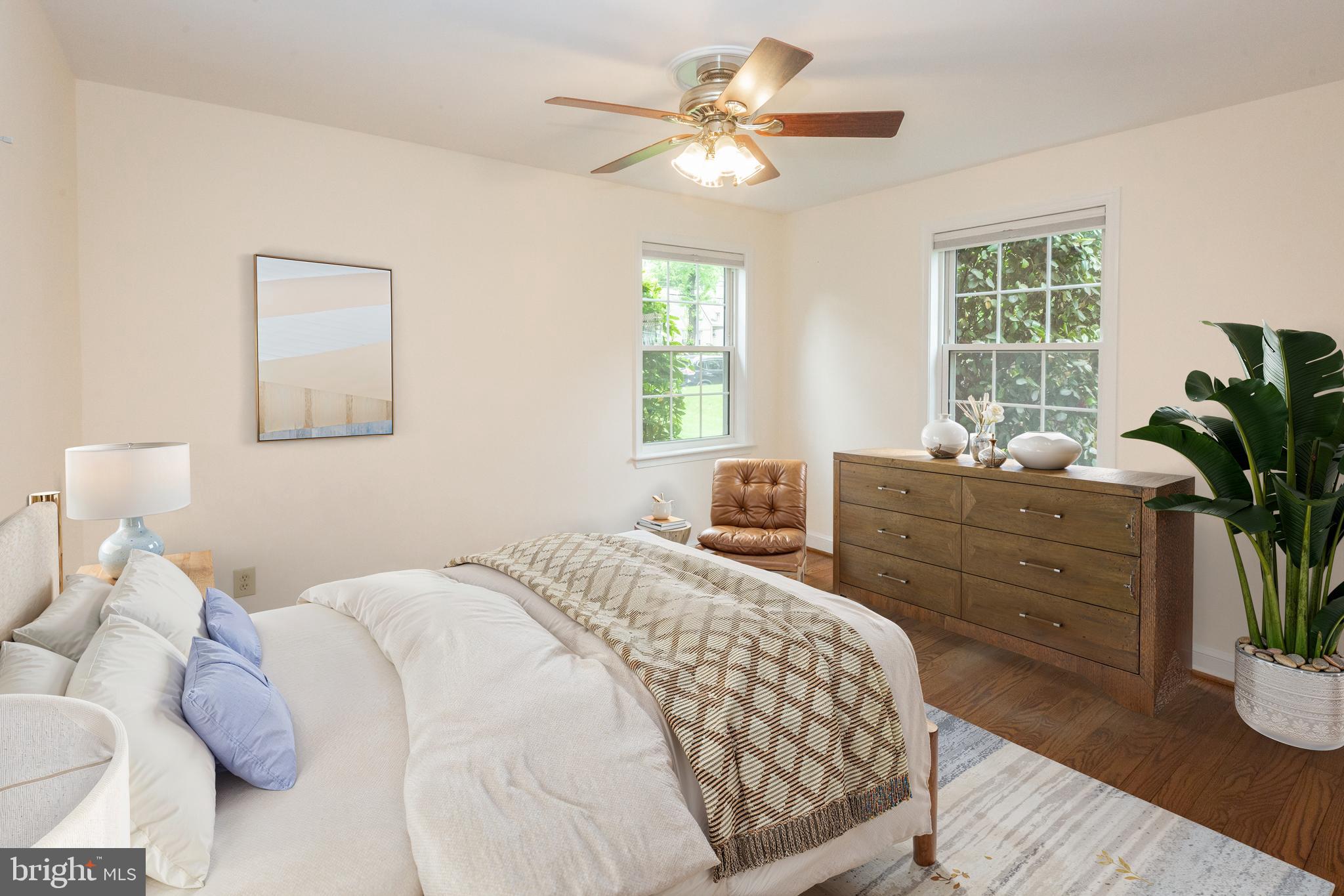 2016 Lansdowne Way Silver Spring, MD 20910 - Photo 9 of 23 a bedroom with a bed and a potted plant