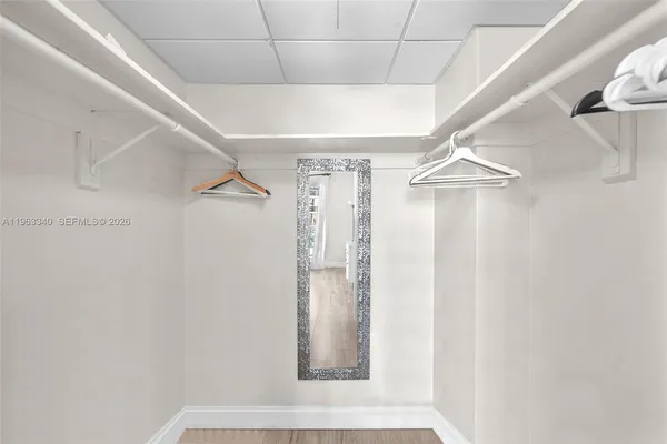 a view of hallway with stairs and a window