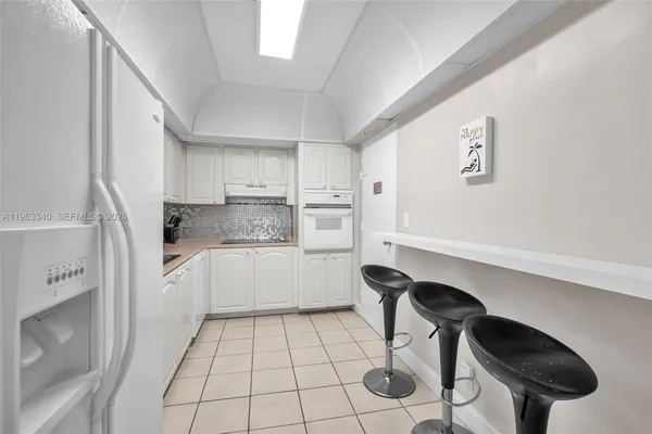 a kitchen with a cabinets and appliances