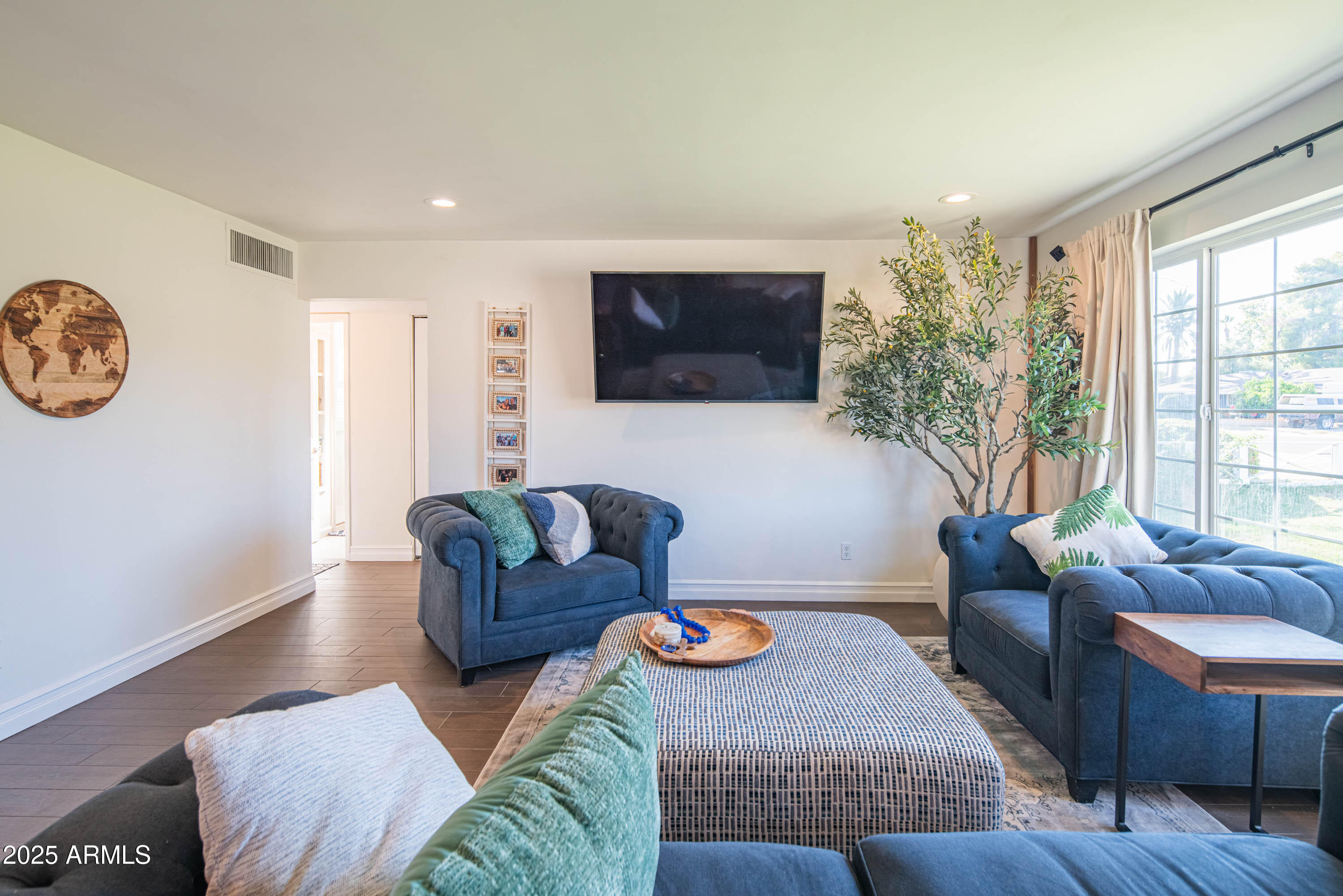 1909 East Bethany Home Road Phoenix, AZ 85016 - Photo 11 of 71 a living room with furniture and a flat screen tv
