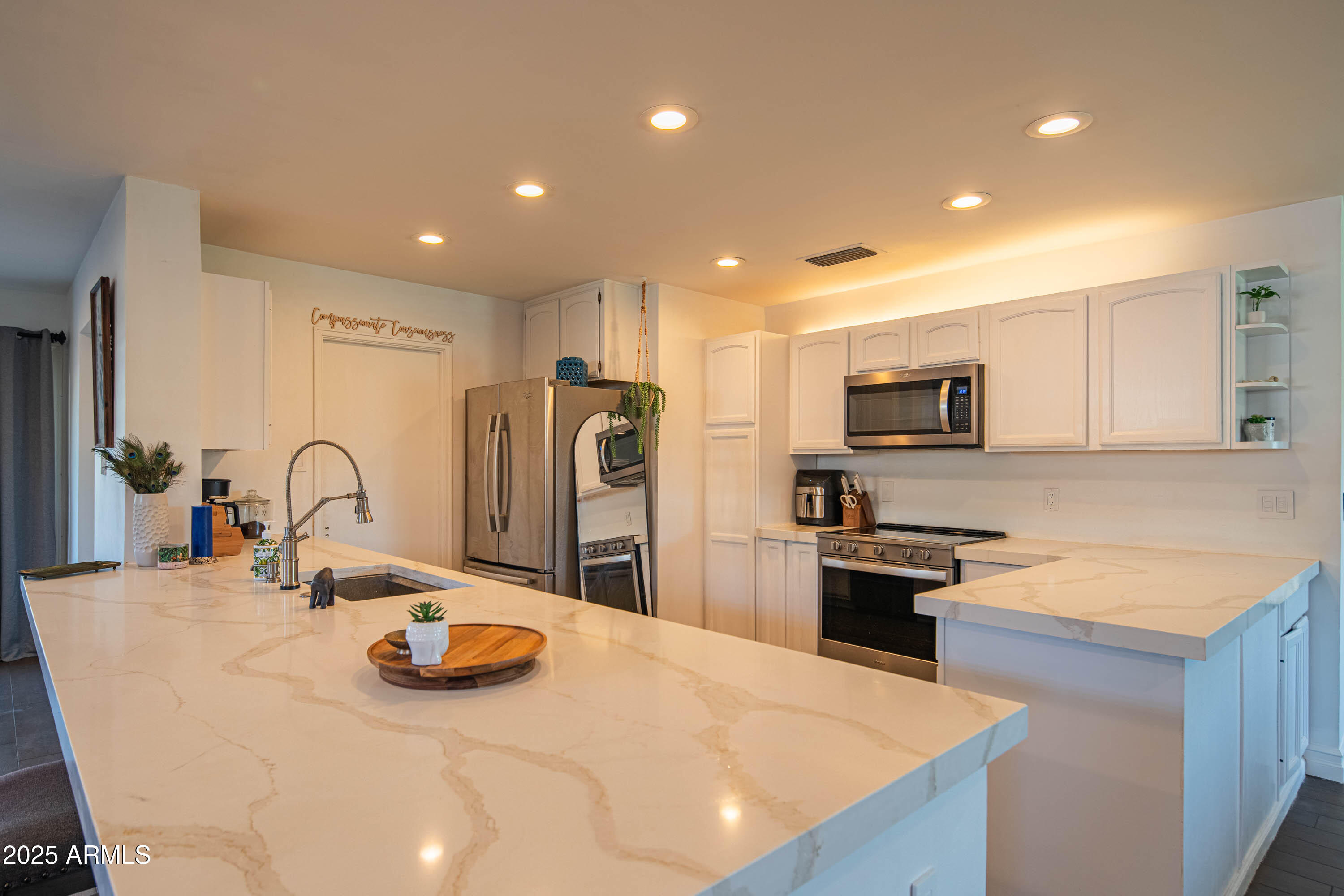1909 East Bethany Home Road Phoenix, AZ 85016 - Photo 19 of 71 a kitchen with stainless steel appliances a microwave a sink a stove a refrigerator a counter top space and cabinets