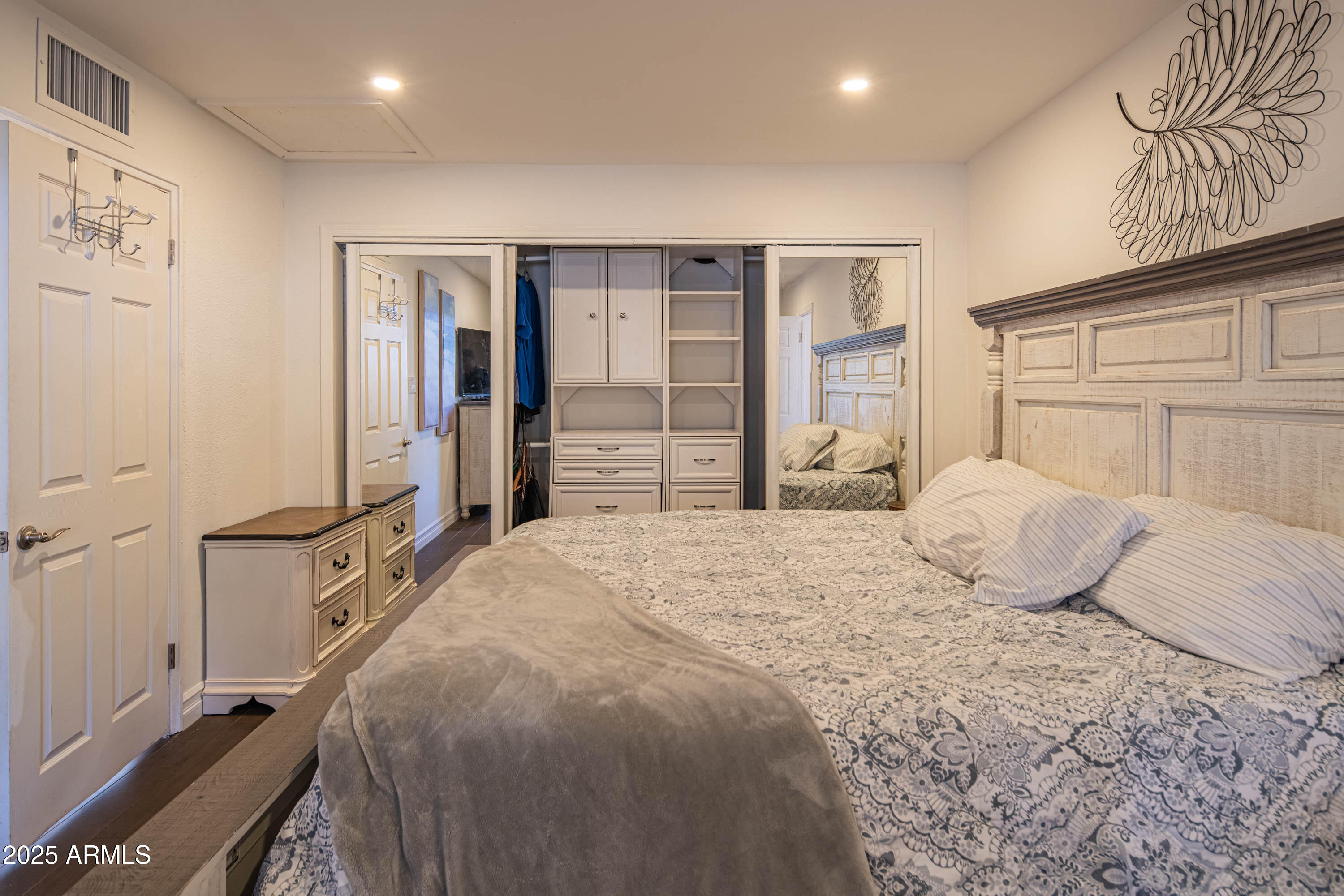 1909 East Bethany Home Road Phoenix, AZ 85016 - Photo 32 of 71 a bedroom with a large bed and a dresser