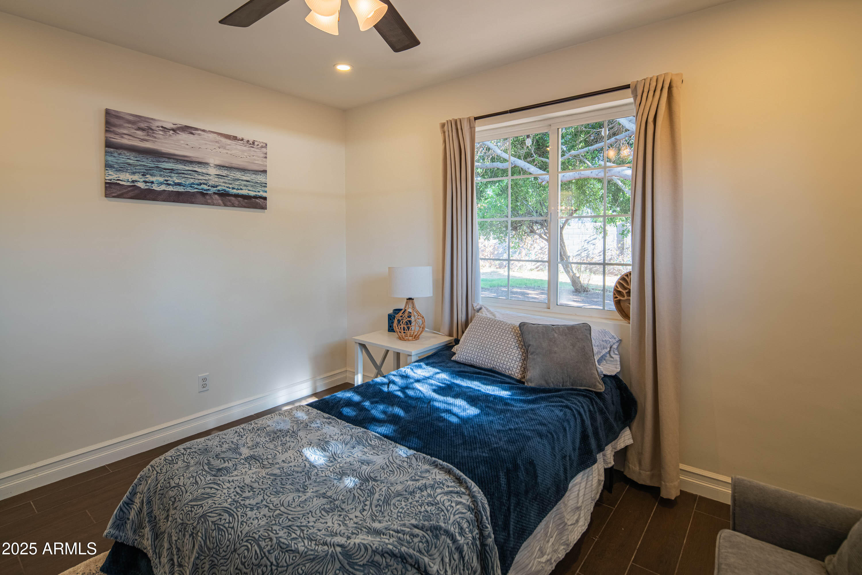 1909 East Bethany Home Road Phoenix, AZ 85016 - Photo 42 of 71 a bedroom with a bed and a window
