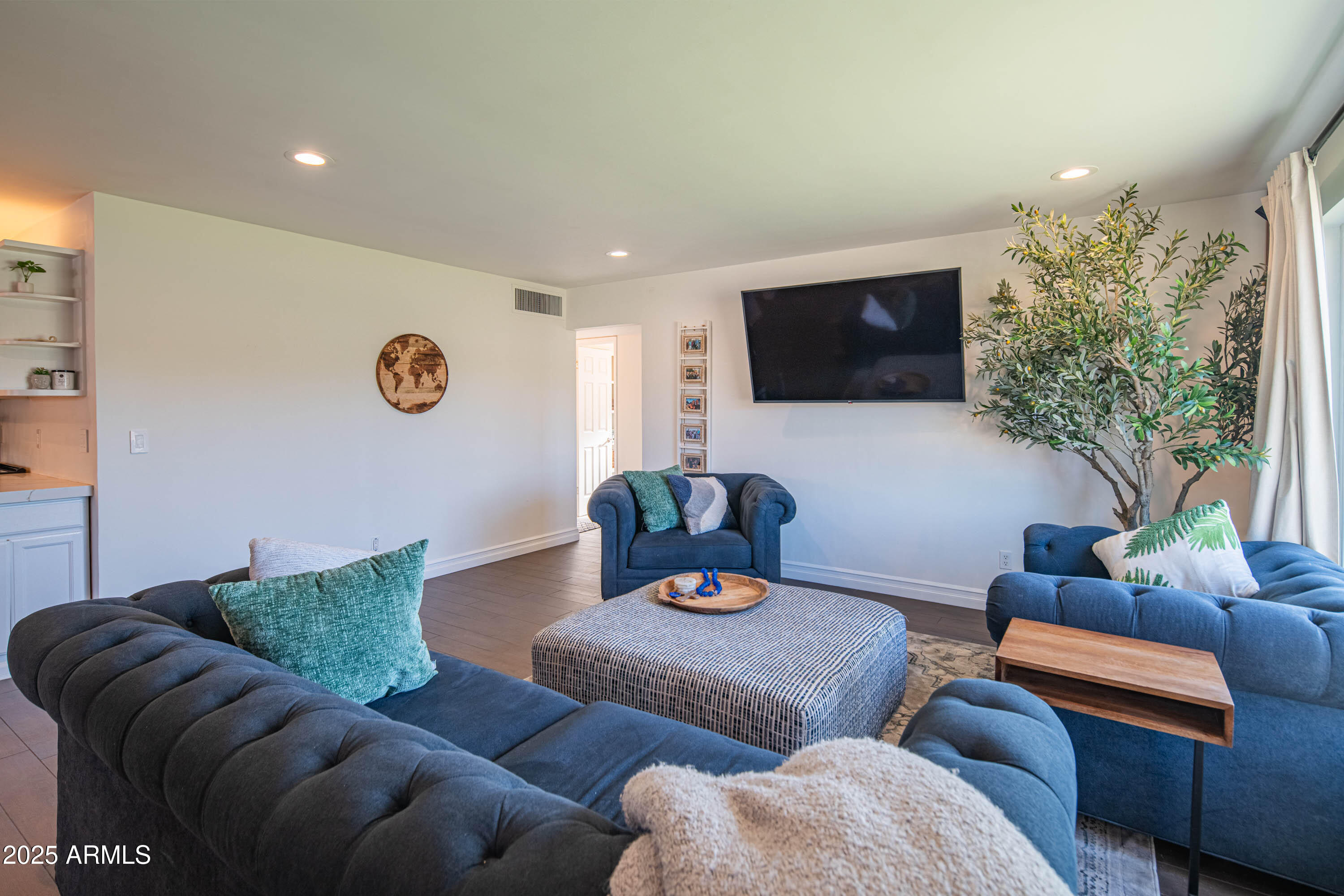 1909 East Bethany Home Road Phoenix, AZ 85016 - Photo 10 of 71 a living room with furniture and a flat screen tv