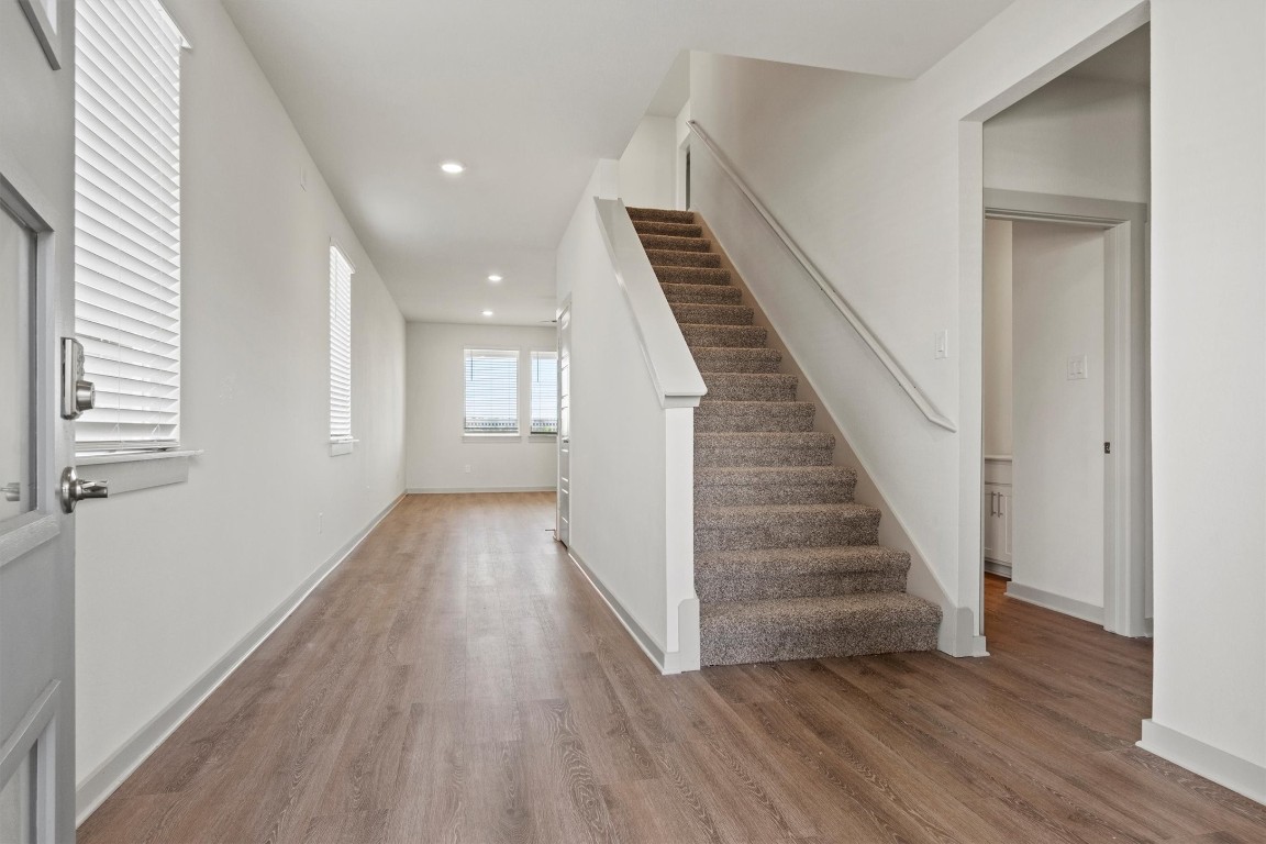 530 Wilshire Road San Marcos, TX 78666 - Photo 12 of 30 a view of a hallway with wooden floor and staircase