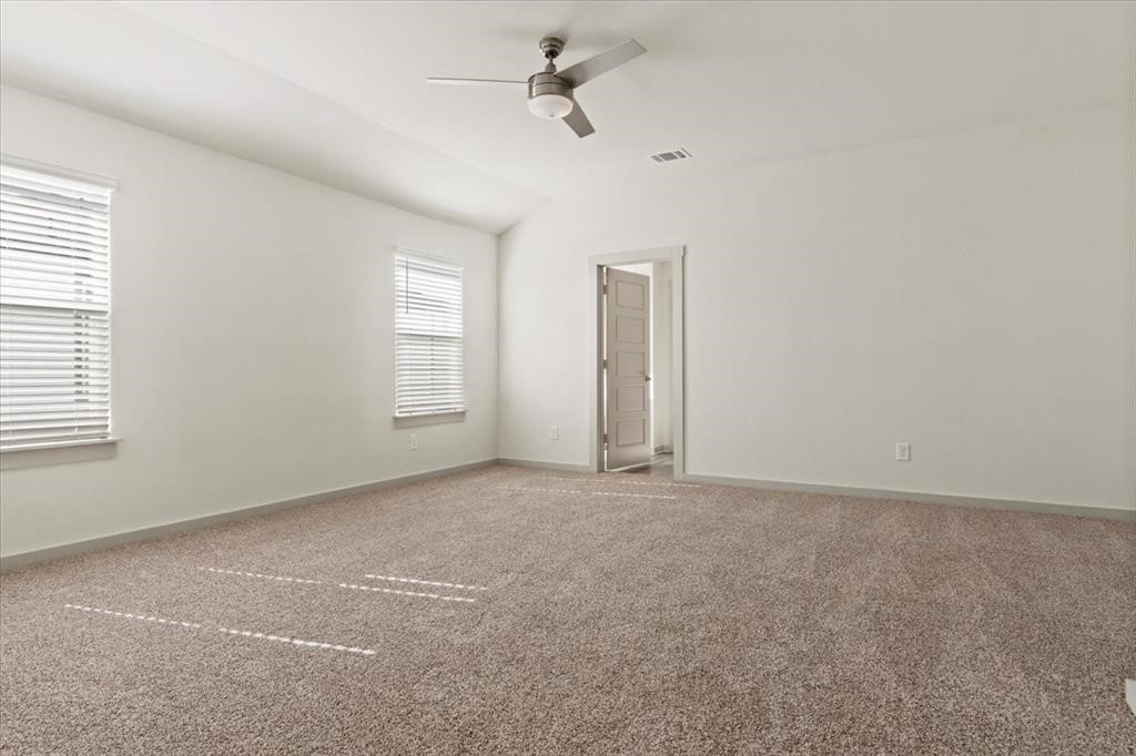 530 Wilshire Road San Marcos, TX 78666 - Photo 16 of 30 an empty room with windows and fan