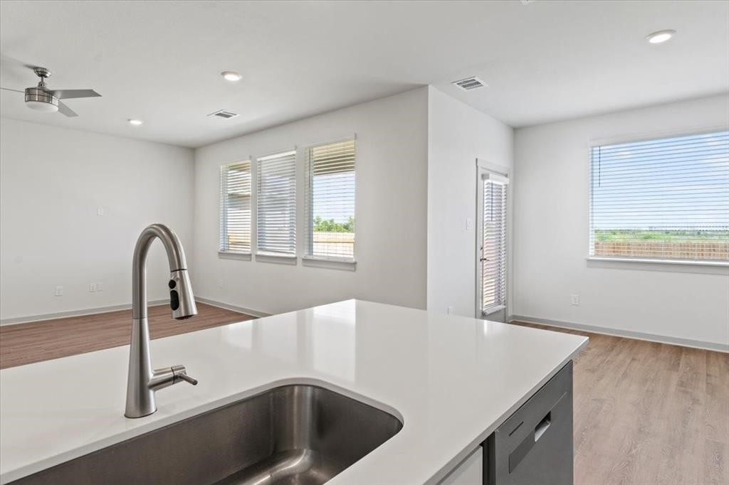 530 Wilshire Road San Marcos, TX 78666 - Photo 9 of 30 a kitchen with a sink a counter top and a stove