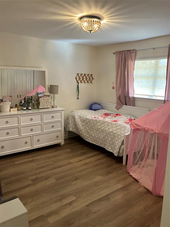 233 Church Road Stonewall, LA 71078 - Photo 8 of 32 Bedroom featuring dark wood-style floors and a chandelier