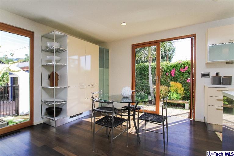 386 South Meridith Avenue Pasadena, CA 91106 - Photo 11 of 28 a living room with furniture and a large window