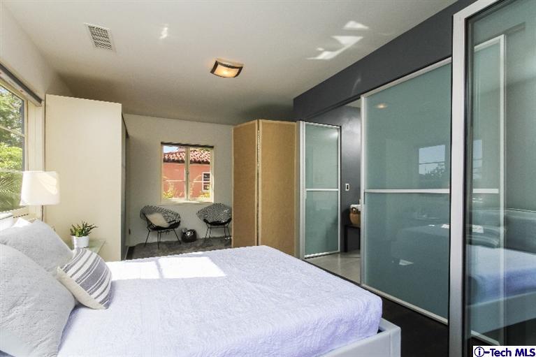 386 South Meridith Avenue Pasadena, CA 91106 - Photo 18 of 28 a bedroom with a bed and a large window
