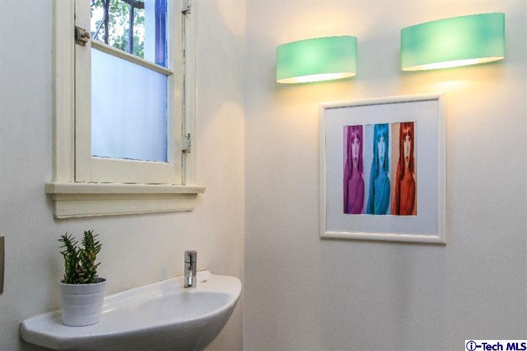 386 South Meridith Avenue Pasadena, CA 91106 - Photo 22 of 28 a bathroom with a sink and a mirror