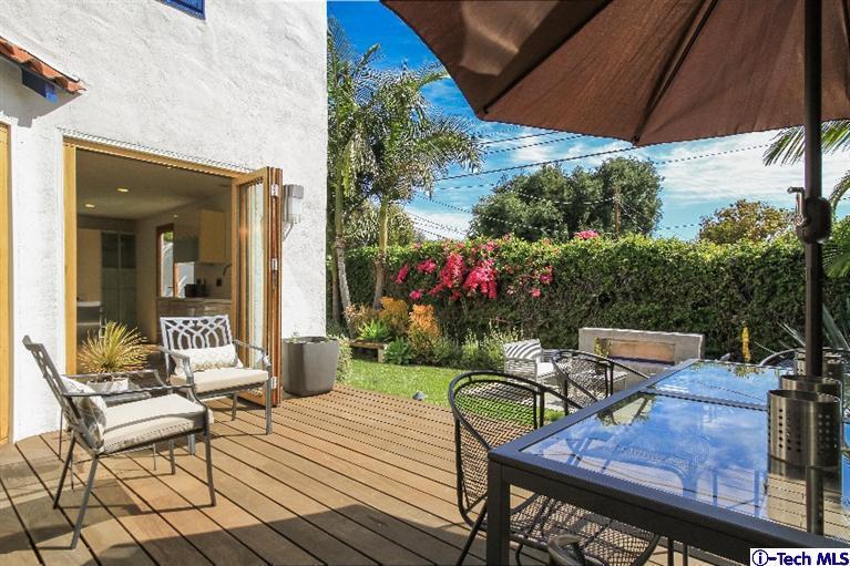 386 South Meridith Avenue Pasadena, CA 91106 - Photo 24 of 28 a view of a patio with table and chairs potted plants with wooden floor