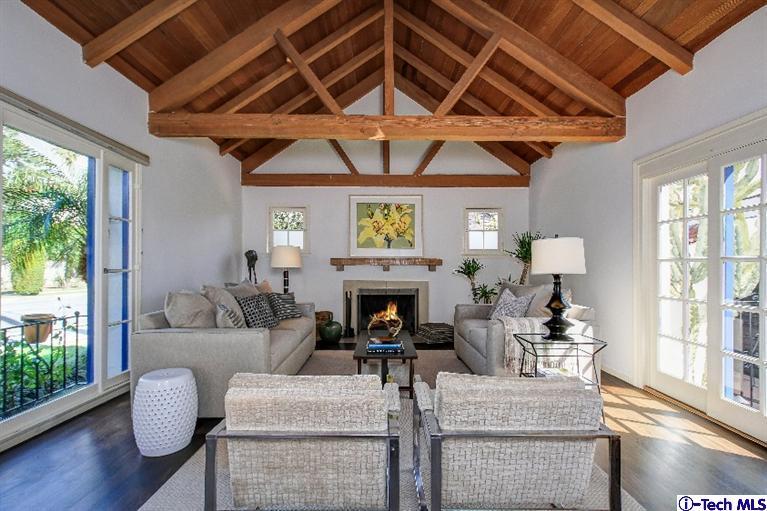 386 South Meridith Avenue Pasadena, CA 91106 - Photo 5 of 28 a living room with furniture a fireplace and a large window